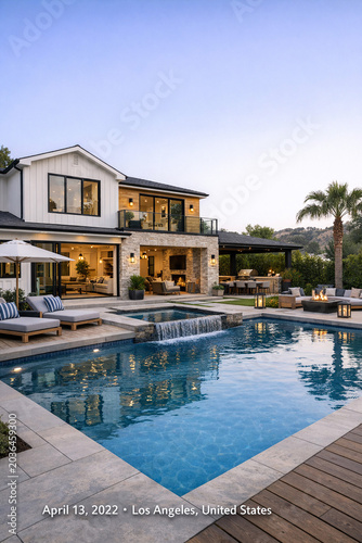 A modern multi-million dollar mansion in LA featuring an infinity pool overlooking a stunning backdrop of hills and nature.