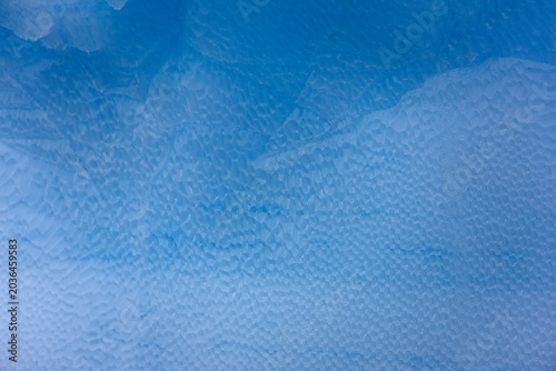 South Orkney blue iceberg on a cloudy winter day.