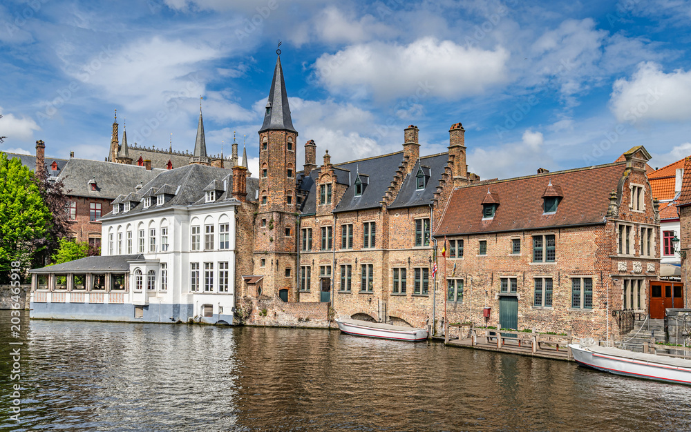 Fototapeta premium Bruges, Belgium – Historic buildings along the Rozenhoedkaai Canal in Bruges 
