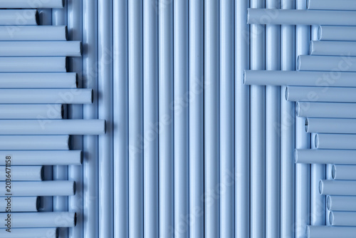 Foto Light blue tubes arranged in vertical and horizontal patterns forming abstract i