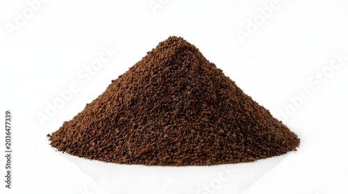 Pile of dark brown coffee ground on white background