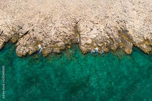 Photography Minimal aerial composition of rocky Adriatic shoreline and emerald turquoise sea near Stara Baška in Croatia