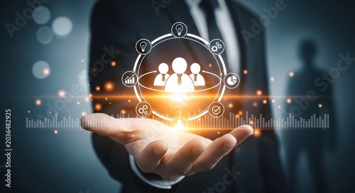 Businessman holding a glowing holographic display with people icons, symbolizing human resources, team management, and digital business connections in a modern tech environment.