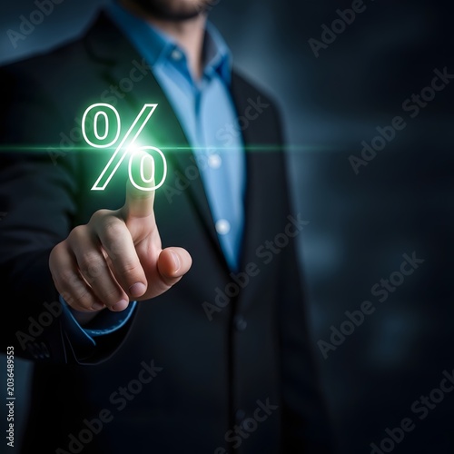Businessman interacting with a glowing percentage sign on a digital interface