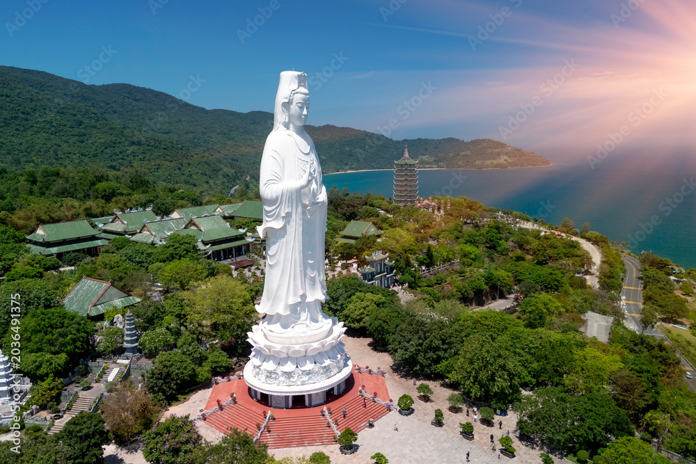 Naklejka premium White Buddha statue Lady Buddha at Linh Ung Pagoda, Danang, Vietnam in a summer day