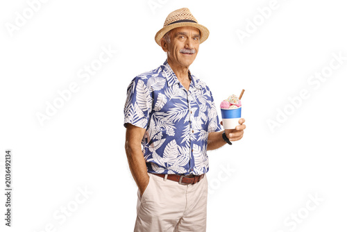 Elderly man holding ice cream in a cup