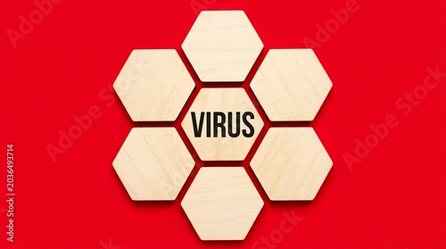 Wooden hexagonal tiles with the word virus written on a red background conceptualizing medical research.