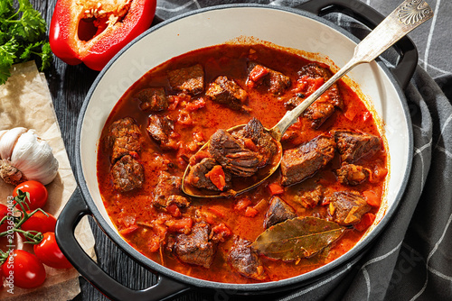 Beef goulash stew with paprika in ceramic pot