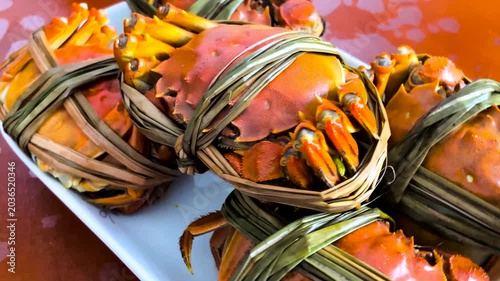 Steamed Crabs Tied With Reeds on Plate