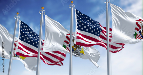 Obraz na płótnie Illinois state flags waving with the national flag of the American flags on a clear day