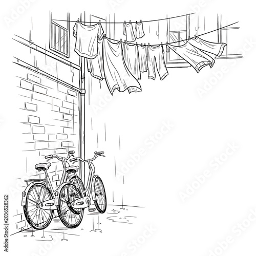 Tableau sur toile Bicycle parked under clothes line drying.