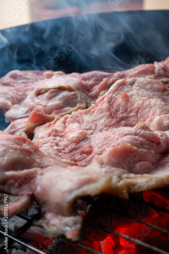 Pork snout being cooked on a small homemade barbecue; a cut of meat known in Spain as 'morros', commonly eaten as a snack