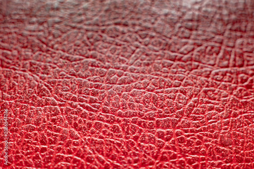 Macro texture of red faux leather background