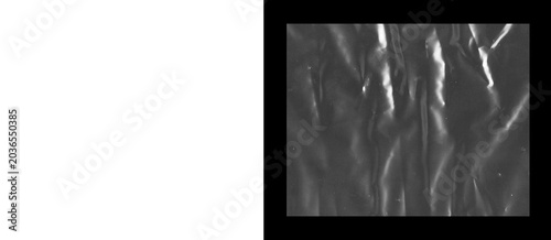 Tableau sur toile Crumpled black plastic texture, wrinkled dark polyethylene film background, abst