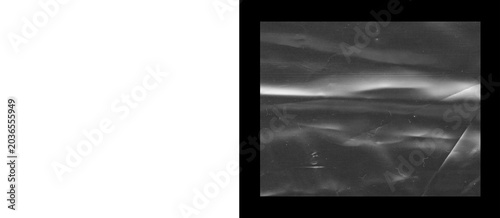 Fotografía Crumpled plastic texture on black background, wrinkled transparent film overlay,