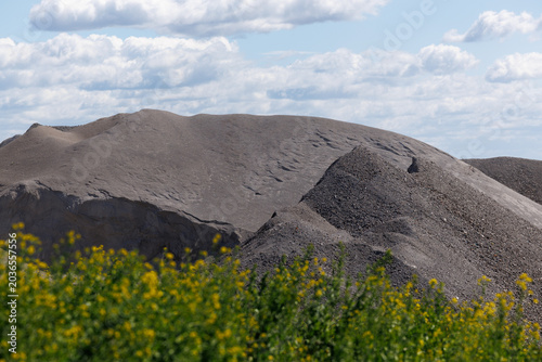 Industrial Waste Ash and Slag Landfill Landscape Under Blue Sky