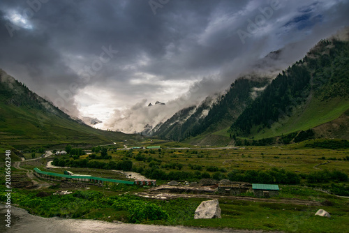 Stormy weather, cloudy sky and dramatic scenic beauty of Himalayan mountains , green mountain valley, way to Kargil from Srinagar, Jammu and Kashmir, India.
