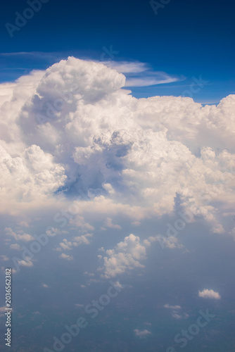 White clouds in blue sky Image shot from flying aeroplane , cloudscape of India.