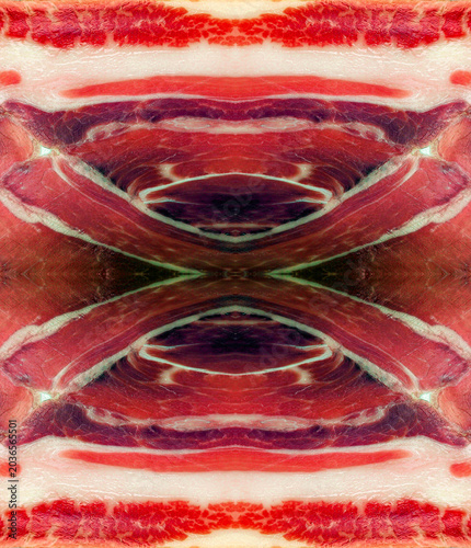 Symmetrical abstract texture pattern made from a macro photography slice of Spanish jamon serrano ham