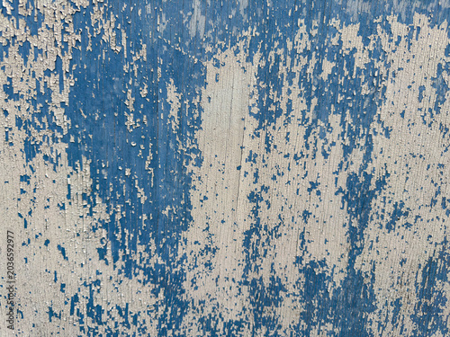 Schilderij op canvas Dynamic interplay of fading blue hues and exposed light substrate forms a captiv