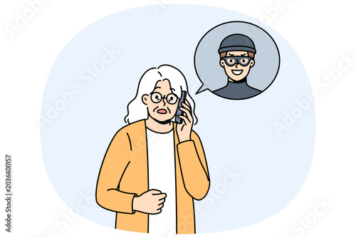 Foto Elderly woman talking to telephone scammer who is trying to find out bank account password