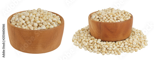 Foto Sorghum seeds in wooden bowl isolated on white background with full depth of field