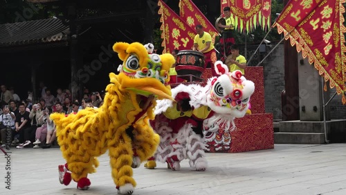 Traditional Chinese Lion Dance Performance with Drummers and Audience