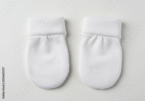 Pair of Soft White Cotton Baby Scratch Mittens for Newborns Isolated on White Background
