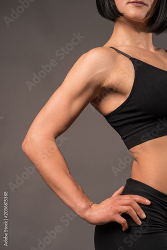 Konstfotografi Toned bicep and shoulder definition of athletic woman