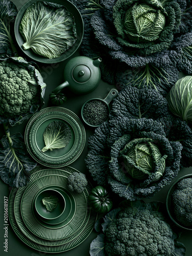 Serene flat lay of green cabbage layers and decorative ceramics
