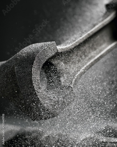 Detailed medium shot capturing shot peening on connecting rods emphasizing the strengthening process that boosts fatigue resistance and overall mechanical reliability.