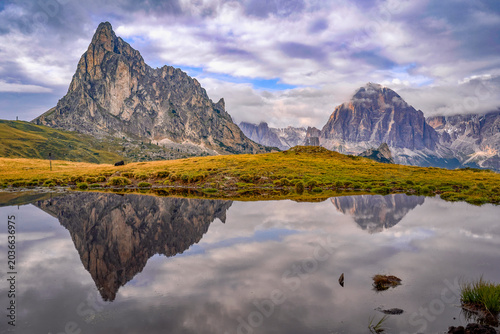 Mirror reflections of Ra Gusela pond in the Dolimte Alps, Italy