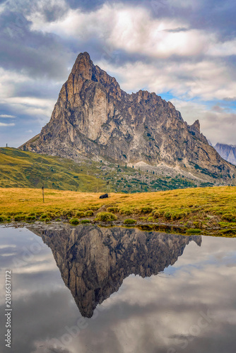 Mirror reflections of Ra Gusela pond in the Dolimte Alps, Italy