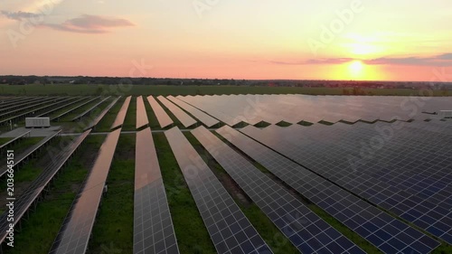 Aerial view of solar panels stand in a row in the fields power ecology innovation nature environment green energy landscape electrical power ecology innovation nature environment