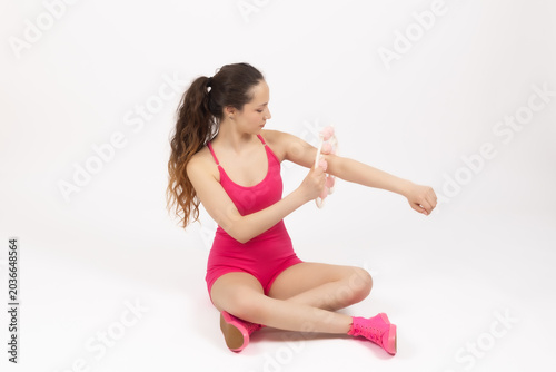 Canvastavla Young woman sitting and stretching her triceps muscle