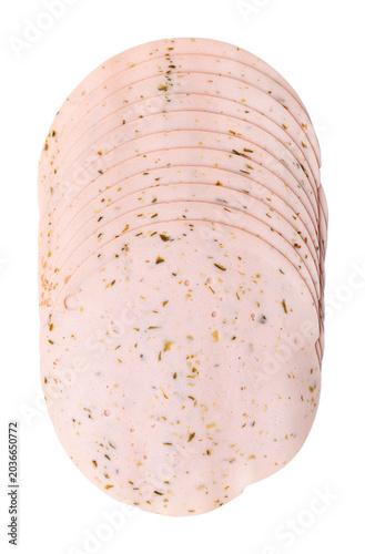 Cold cut vegetarian sausage slices with gherkins. Stack of sliced meatless Extrawurst, scalded protein of milk, egg white and peas, with finely sliced ​​pickled gherkins. Isolated, from above. Photo.