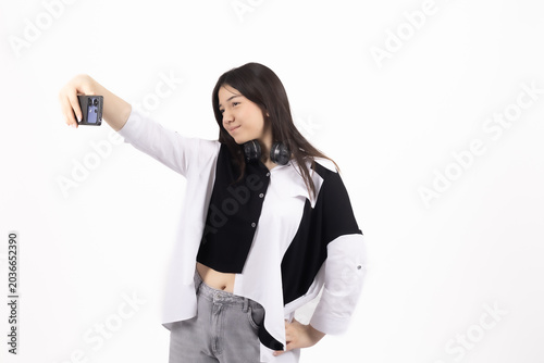 Young woman talking on phone and gesturing with hand