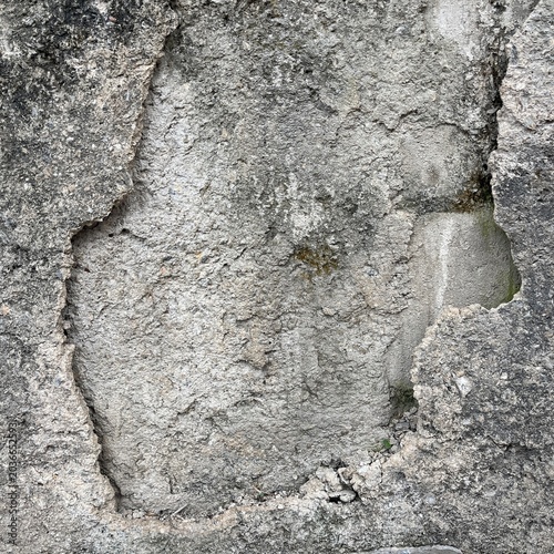 Cracked gray concrete wall texture grunge background close up detail