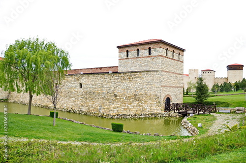 Historical park in Neofit Rilski, Bulgaria, overlooking a large lake with fences and passages, symbolically connecting the different eras of our lands  