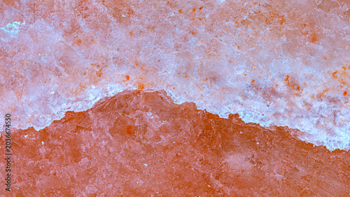 Bild auf Leinwand Salt layer forms on surface, showing texture and colors during daytime at a salt
