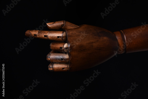 Photos Wooden hand pointing direction with index finger