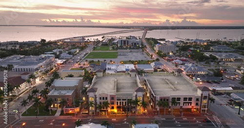 Scenic evening view of downtown Punta Gorda, Florida with illuminated storefronts, historic buildings and relaxed coastal town atmosphere.