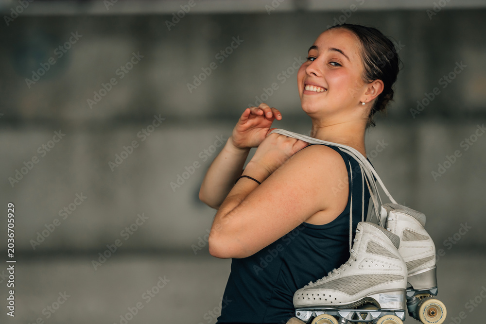 Naklejka premium figure skating athlete with skates smiling outdoors