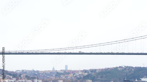 The Istanbul Bosphorus Bridge, ships and cars crossing the Bosphorus Strait