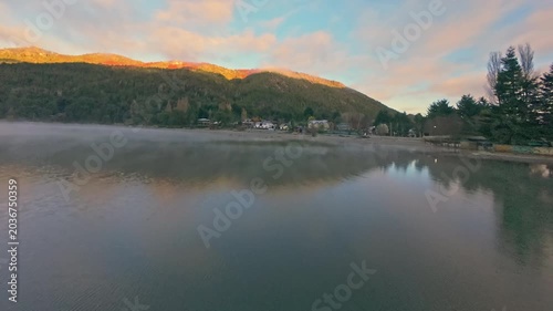 Dynamic FPV Acro Flight Over Lakeside Pier and Forest