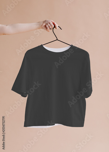 Schilderij op canvas Minimal black t-shirt on hanger, suitable as mockup