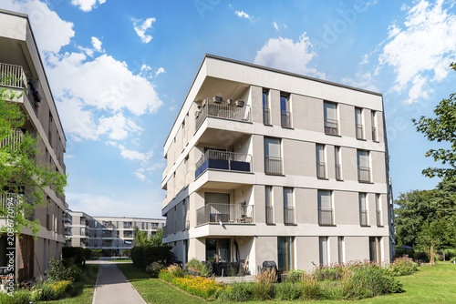 Cityscape of a residential area with modern apartment buildings, new sustainable development and green urban landscape in the city, concept for construction industry and real estate