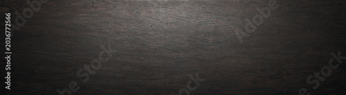 Tableau sur toile Dark ebony wood plank texture against a long background
