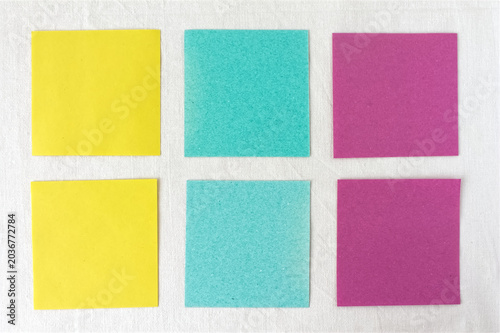 Six blank colorful sticky notes in a grid on white linen background with copy space, multicolored paper options template.