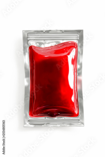 A single transparent plastic sachet filled with bright red liquid sauce, jam, or gel, isolated vertically on a clean white background, presenting a product mockup